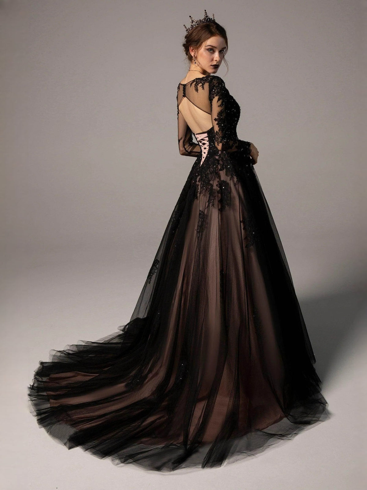 Black V-neck corset wedding dress with floral lace back cutouts and full A-line skirt