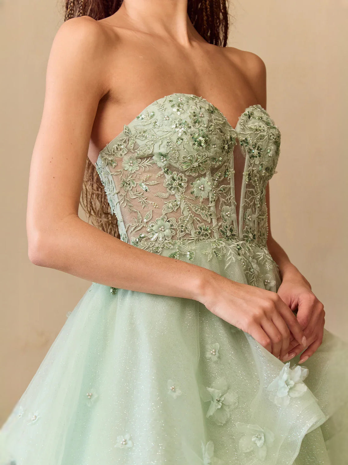 Sage green sweetheart corset bodice with embroidered floral detail and tulle skirt