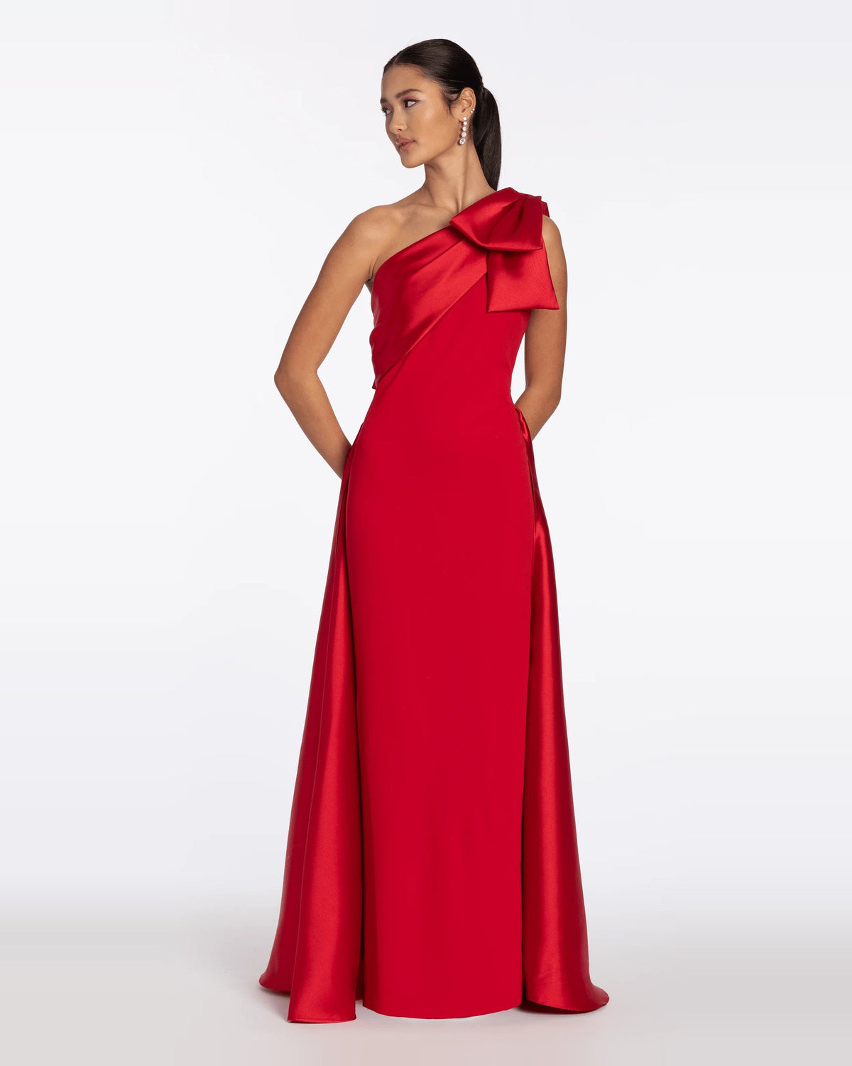 Red one-shoulder column maxi dress with oversized shoulder bow and long back slit