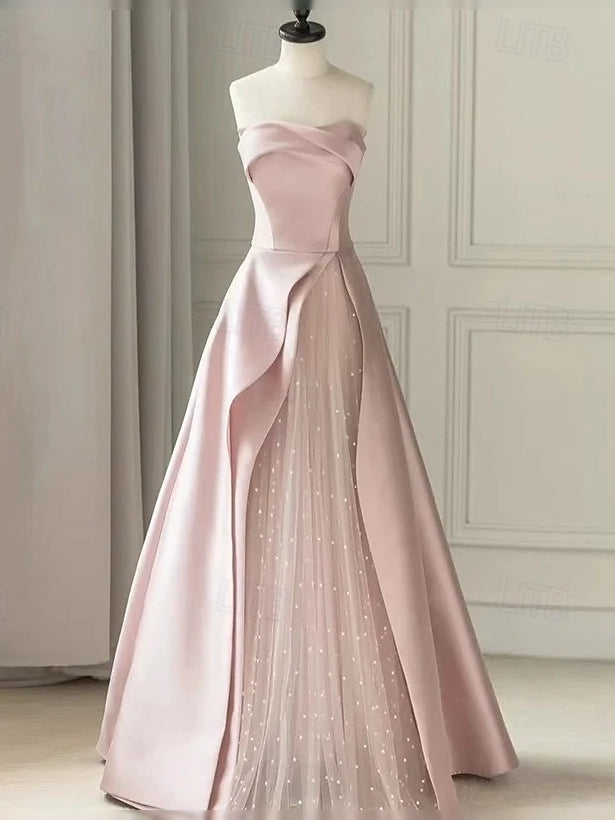 Blush pink sweetheart satin A-line maxi dress with draped side detail and glitter tulle skirt