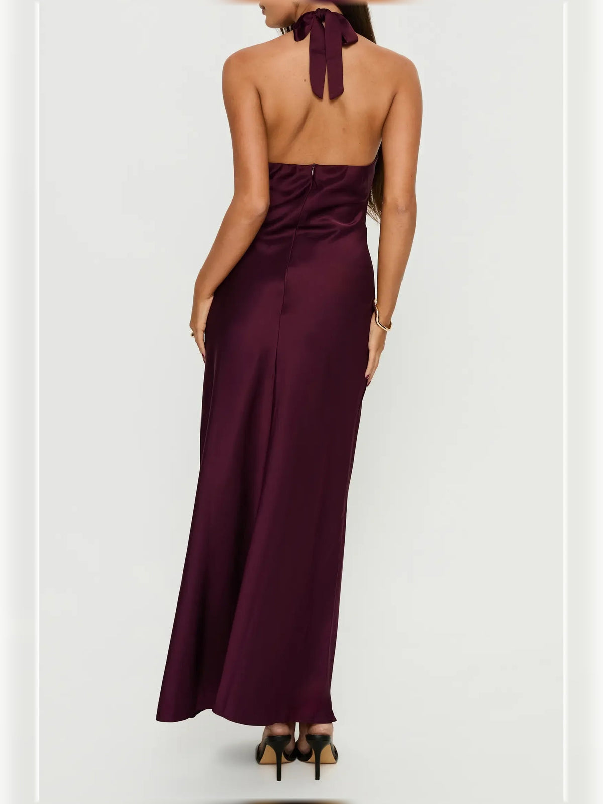 Plum floor-length halter dress, open-back style with bow tie at upper back