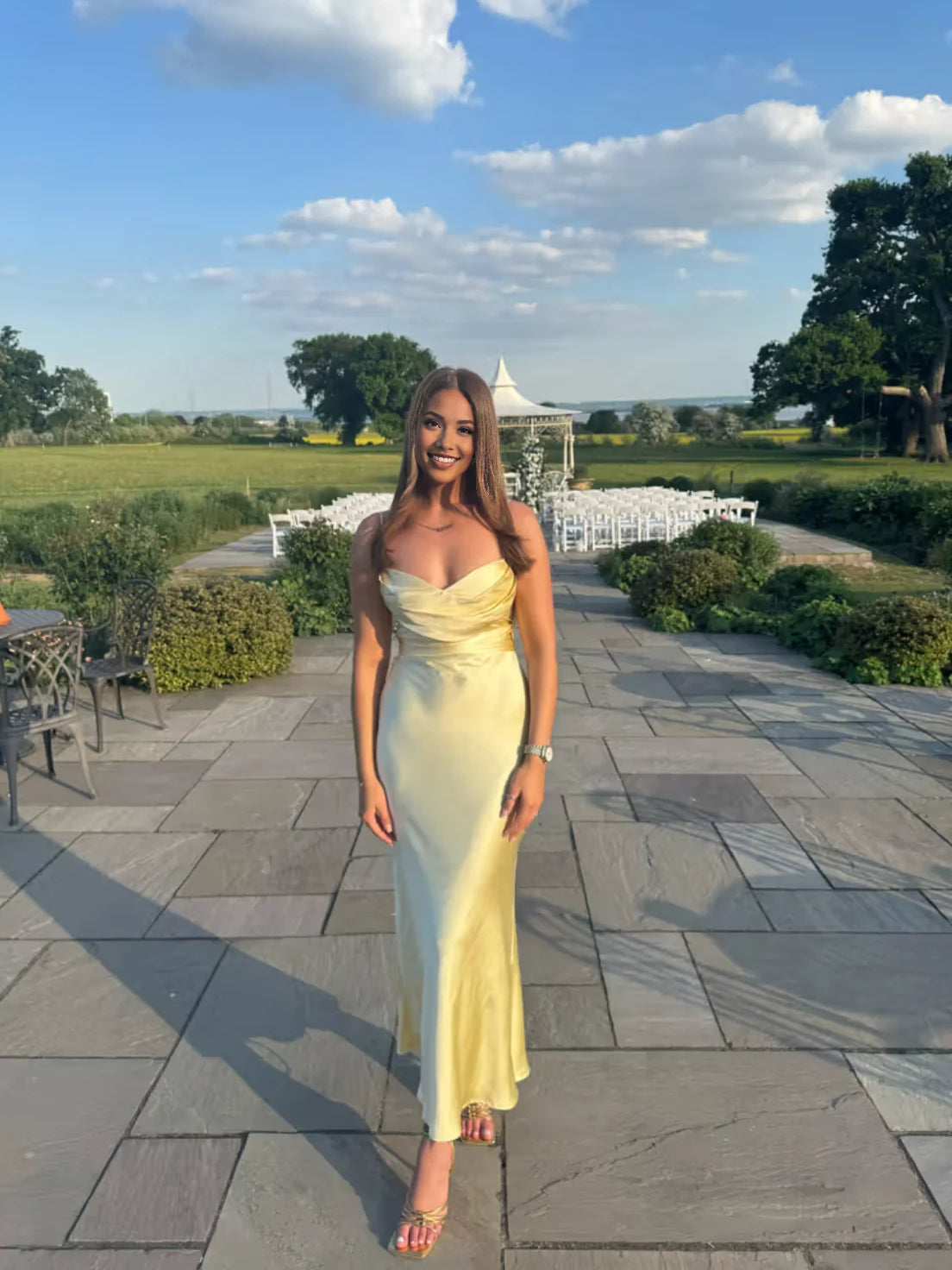 Yellow satin V-neck mermaid bridesmaid dress with thin straps and fitted mid-calf hem