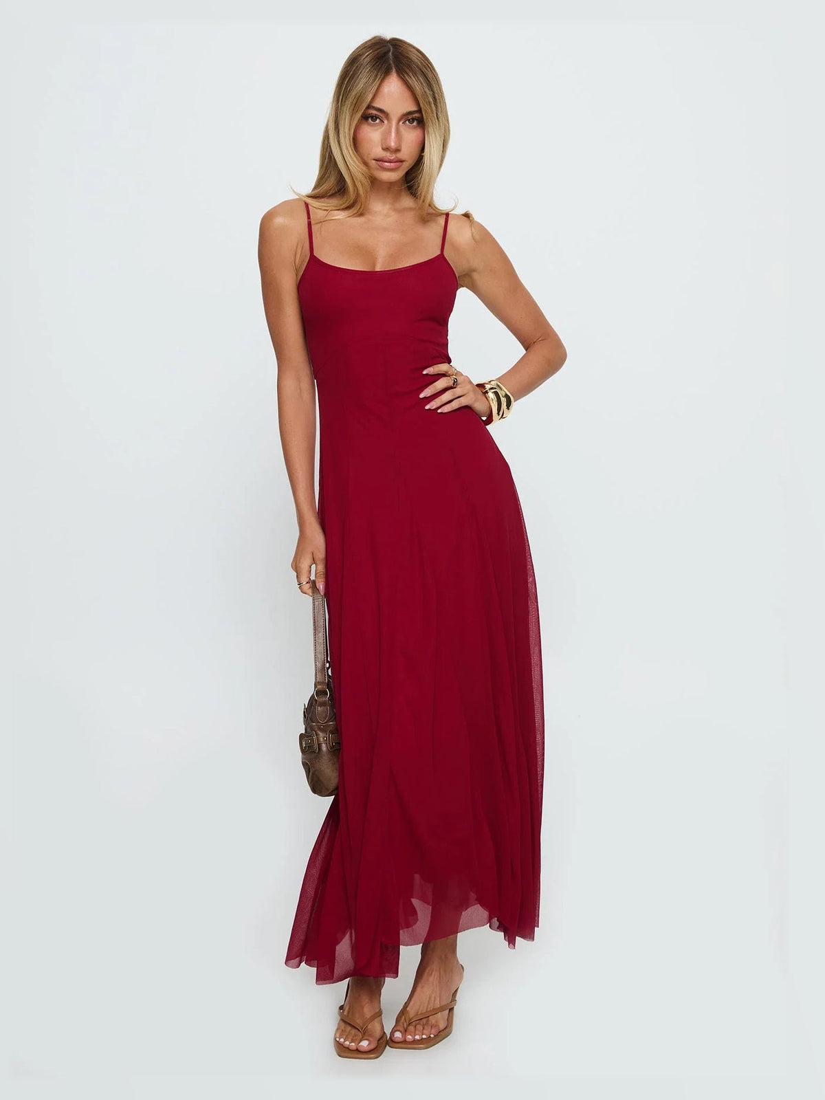 Red formal dress with structured woven fabric construction and maxi hem
