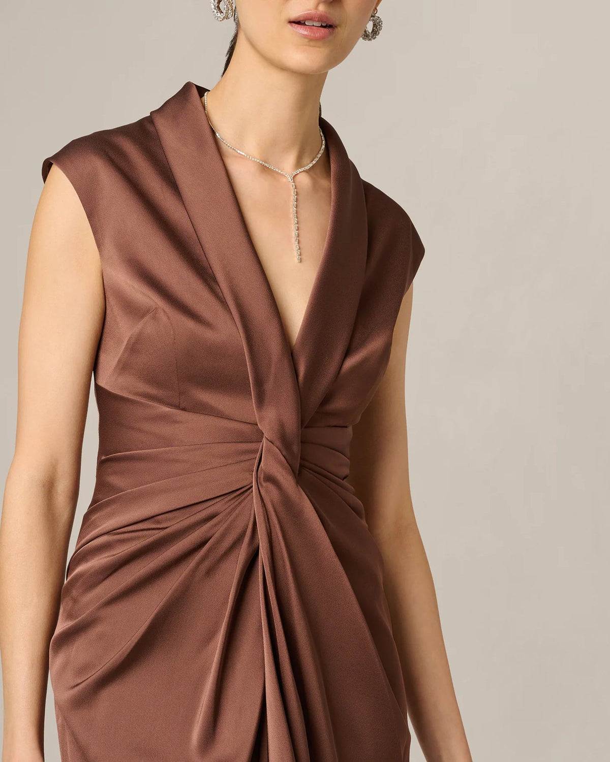 Espresso-brown sleeveless V-neck dress with ruched twist bodice detail