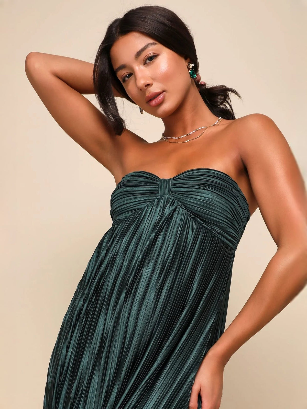 Emerald green strapless satin maxi dress with knotted ruched bodice close-up
