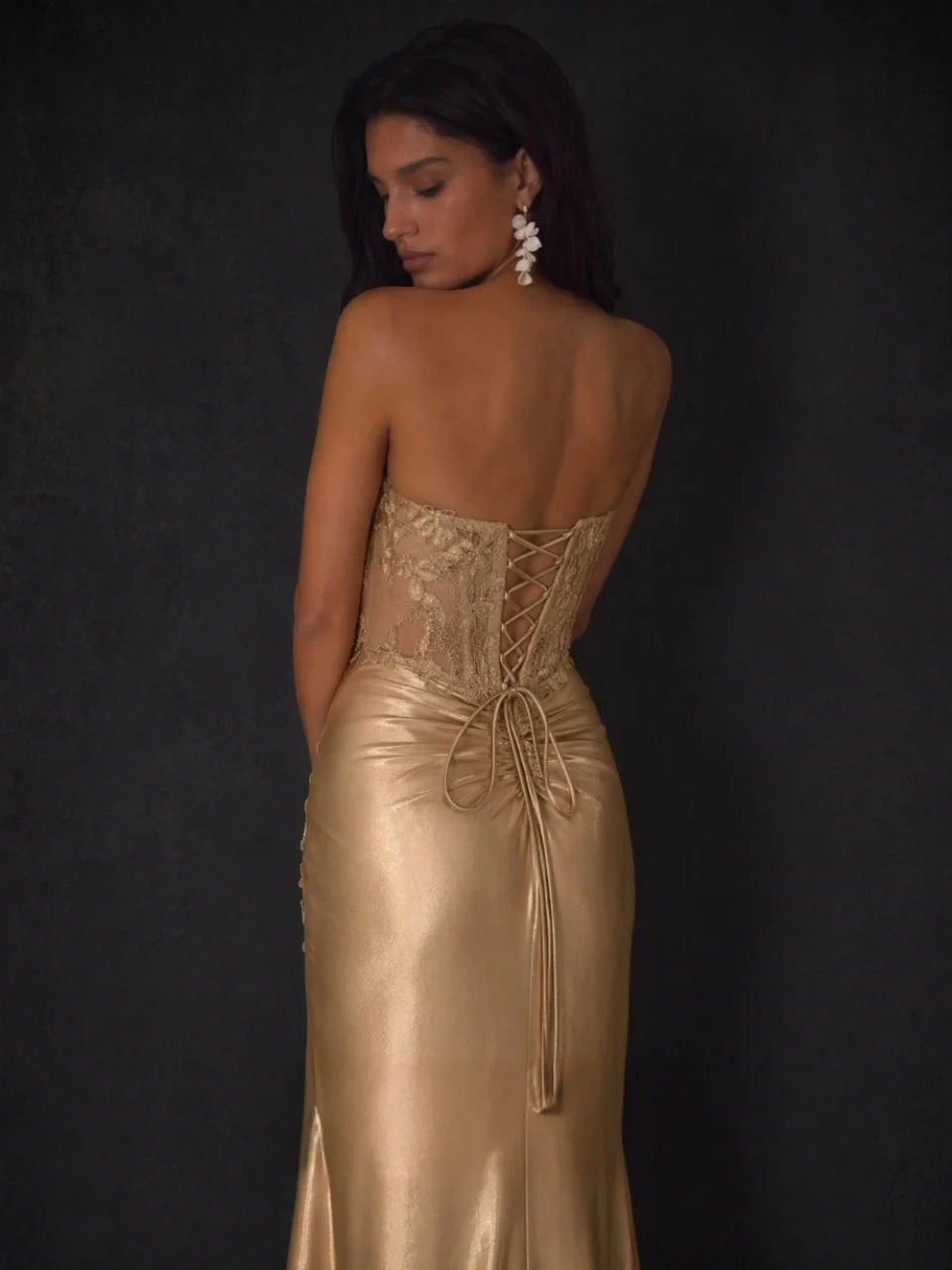 Champagne gold ruched satin sheath dress with lace-up back detail and side slit