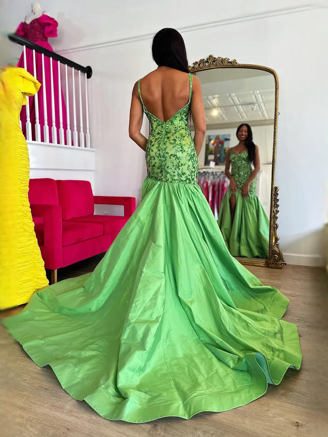 Back view: lime green V-neck mermaid prom dress with beaded floral bodice and layered skirt