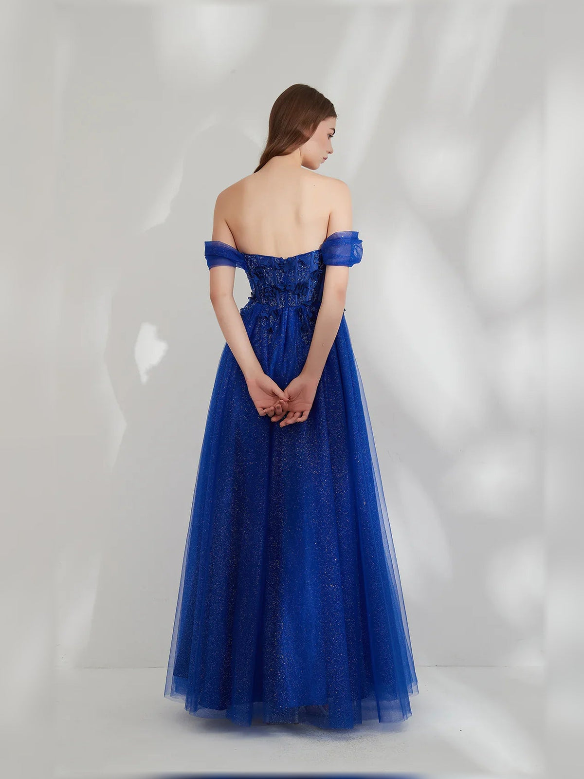 Dark blue off-shoulder open-back floor-length formal dress with ruffled sleeves