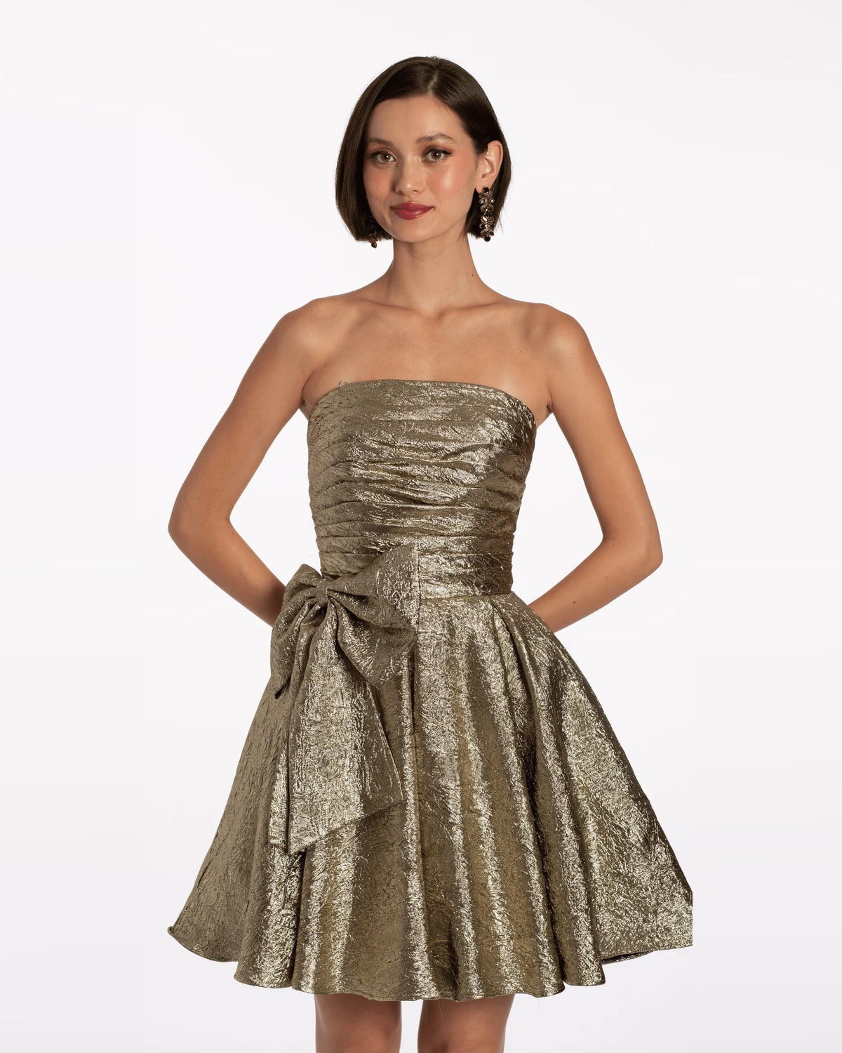 Gold strapless ruched bodice fit-and-flare dress with pleated skirt and waist bow
