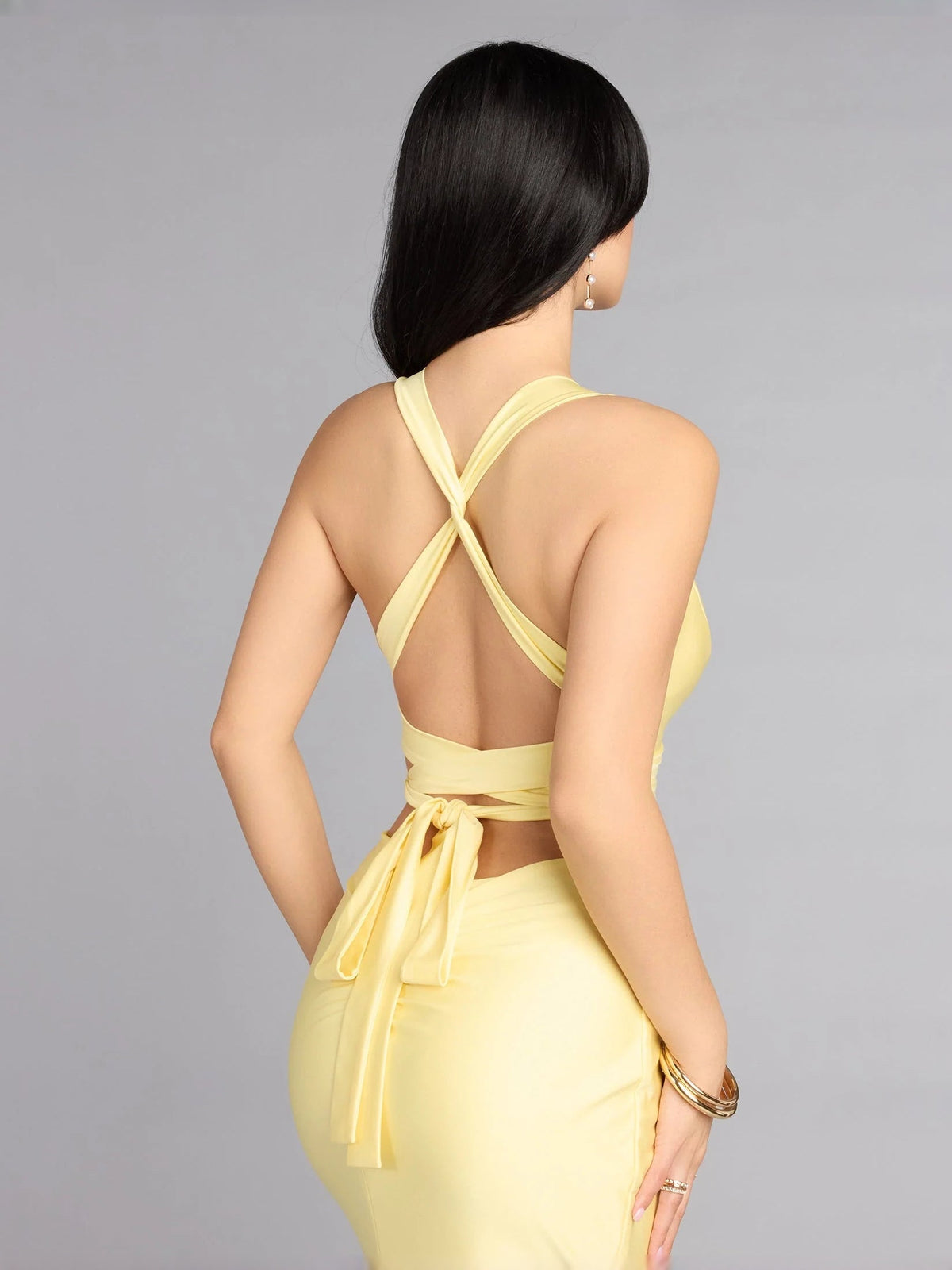 Pale lemon ruched maxi prom dress with crisscross open back and tie waist detail