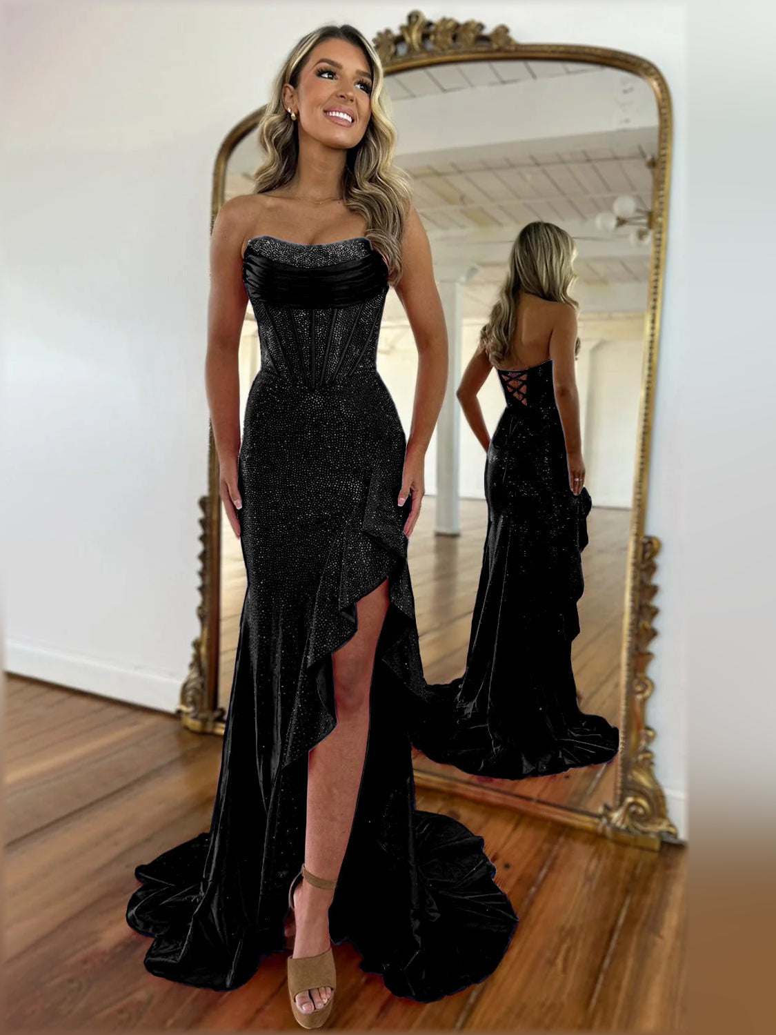 Black strapless mermaid formal dress with sparkling sheen and front leg slit.