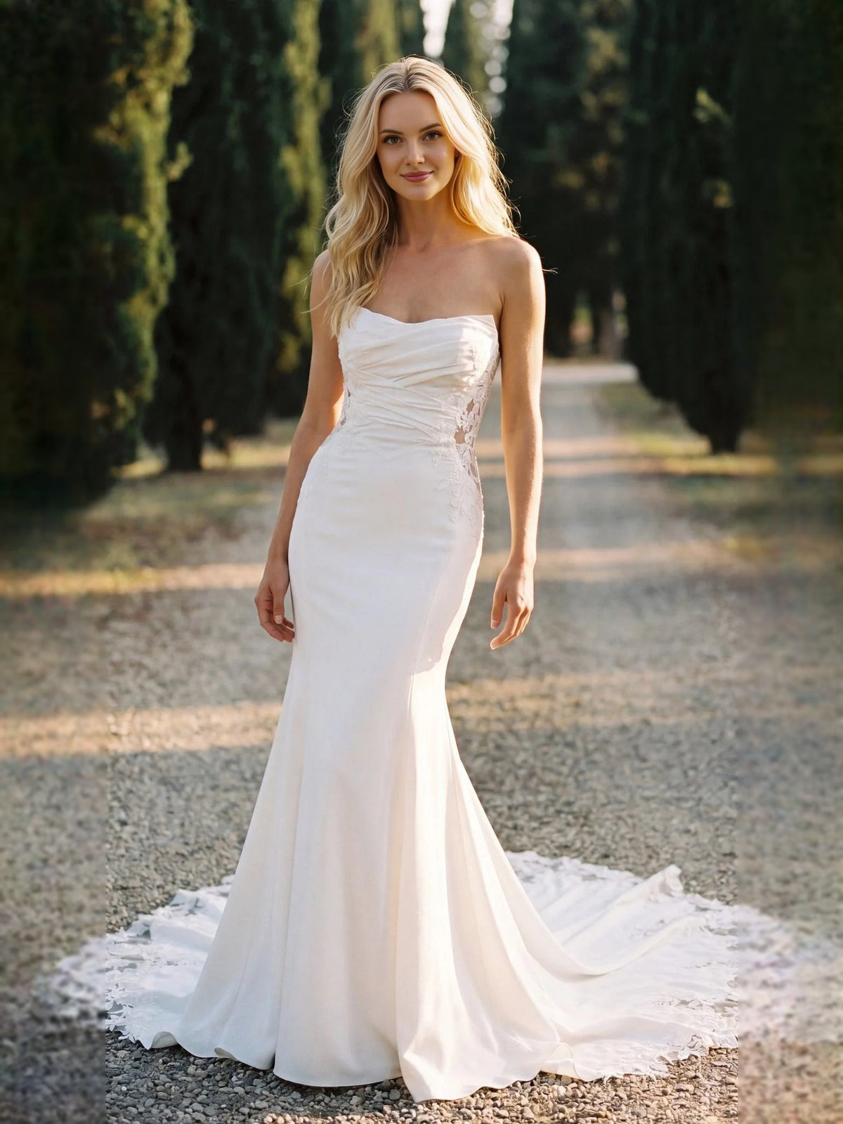 Ivory strapless mermaid wedding dress with ruched bodice and lace trim hem