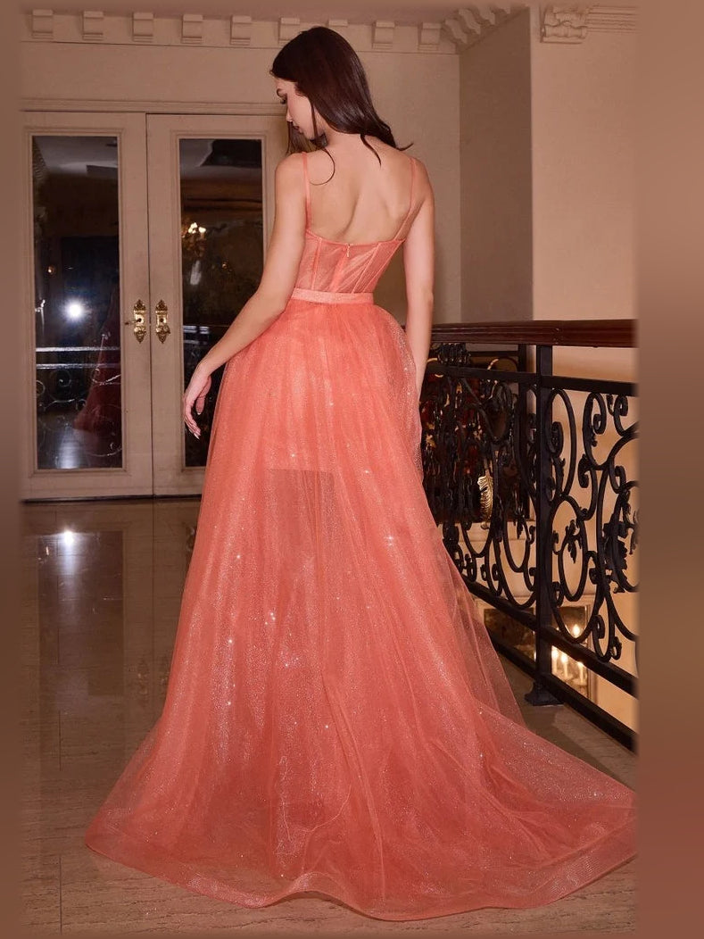 Coral pink corset-style formal dress back view with spaghetti straps and floral waist detail