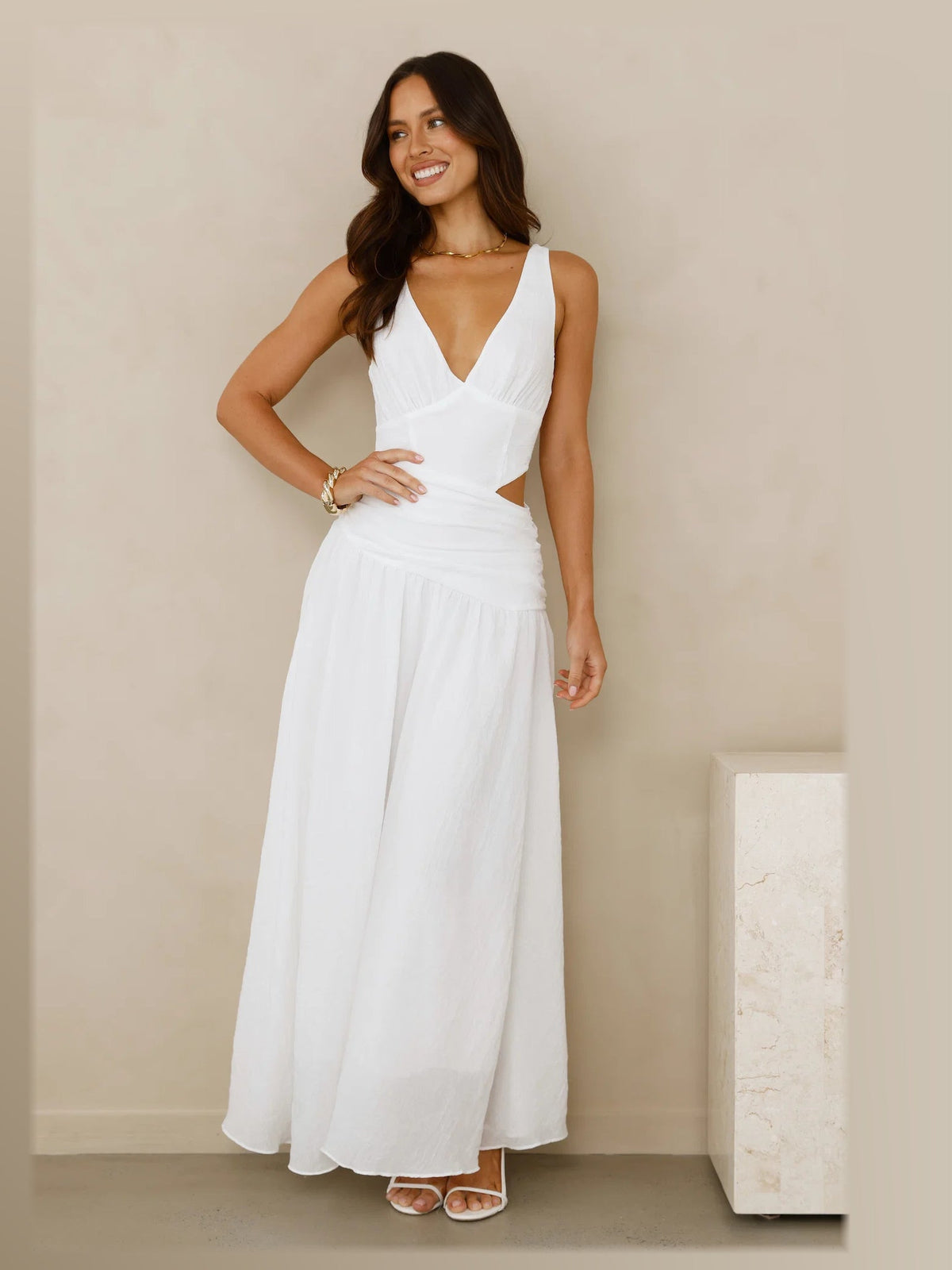 White formal dress with structured woven fabric construction and maxi hem