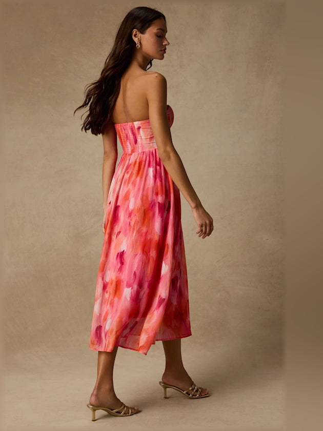 Coral pink abstract strapless midi formal dress, side view with sweetheart bustier