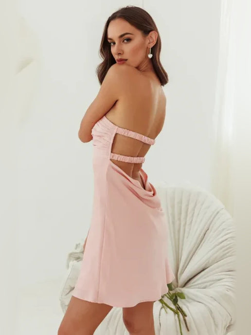 Light pink satin mini dress with sweetheart bodice and open back strap cut-outs