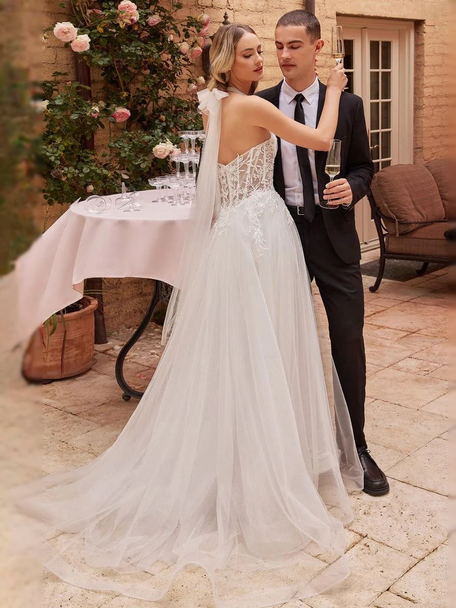 White tulle A-line wedding dress with sweetheart corset bodice and lace bodice detail