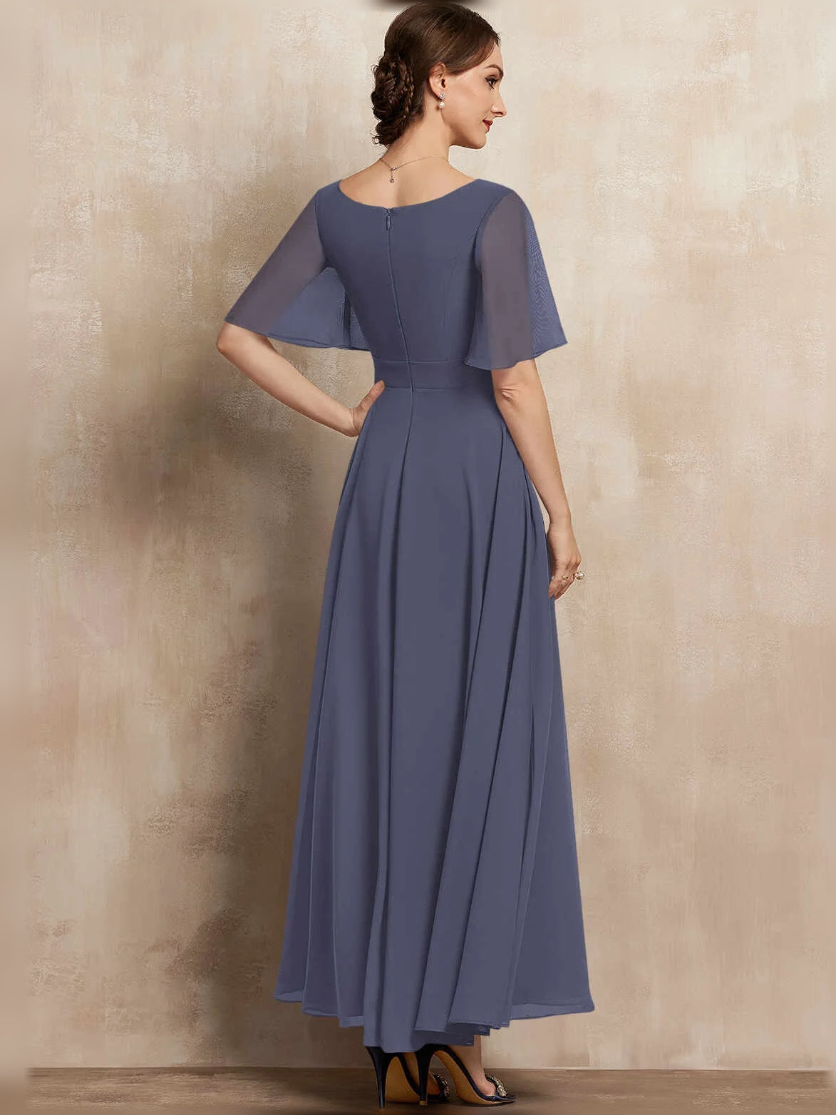 Stormy navy chiffon maxi dress with V-neck, pleated A-line skirt, flutter sleeves, and beaded waist