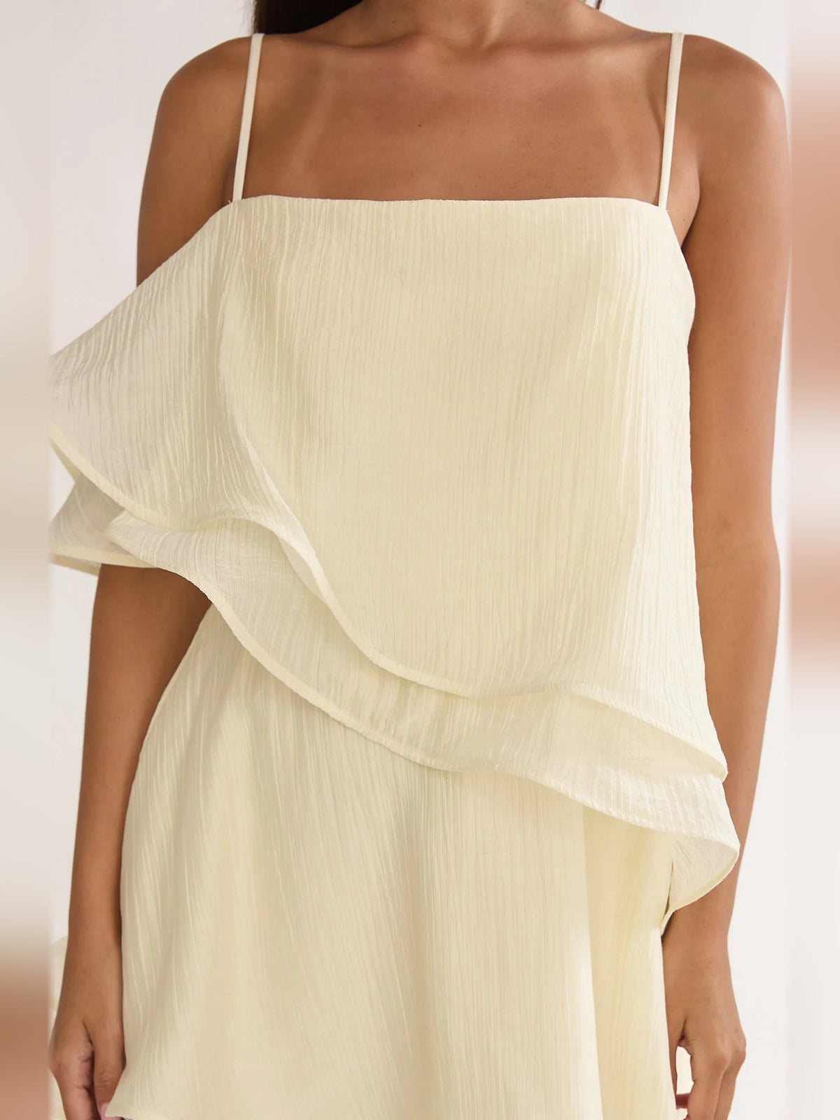 Cream mini dress bodice with spaghetti straps and draped layered ruffle detail