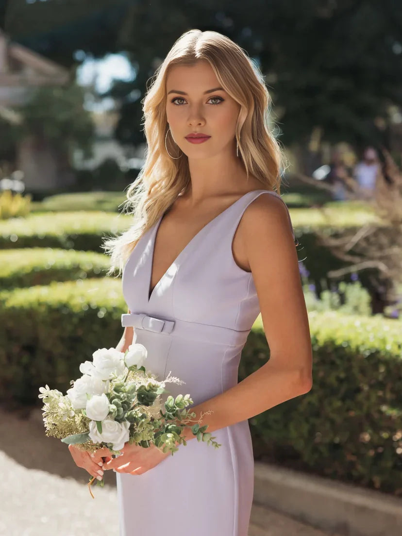 Lilac V-neck sleeveless mermaid formal dress with waist belt detail and flowing skirt.