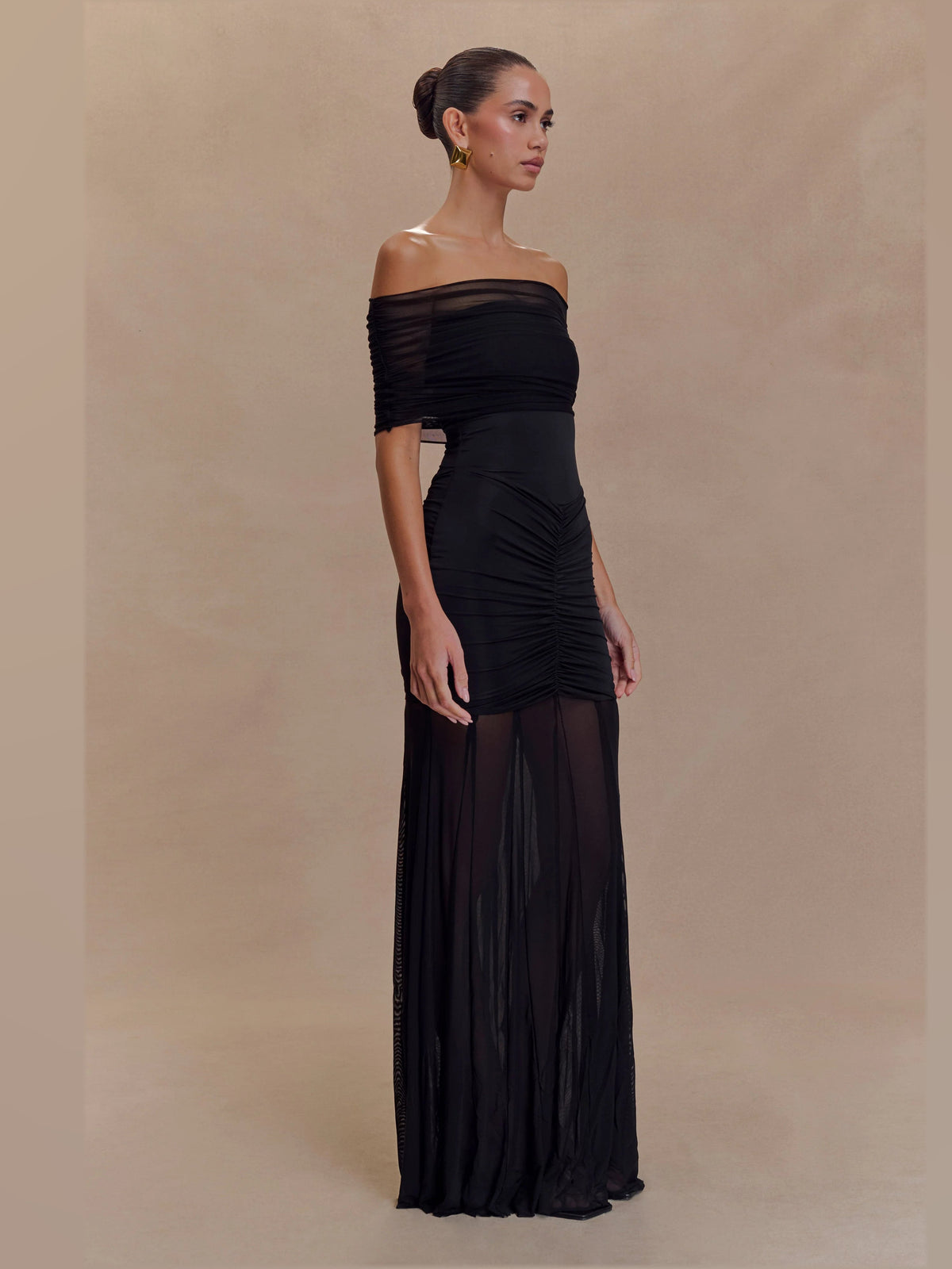 Black formal dress with mesh construction and maxi hem