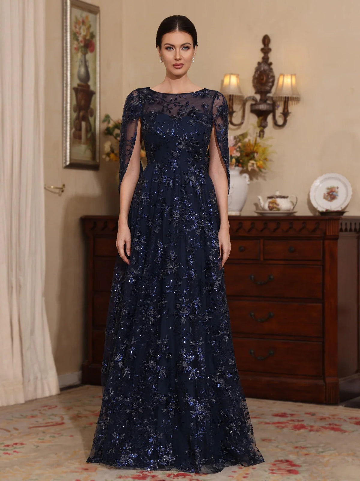 Dark navy floral-embroidered tulle A-line dress with illusion bateau neckline, full length