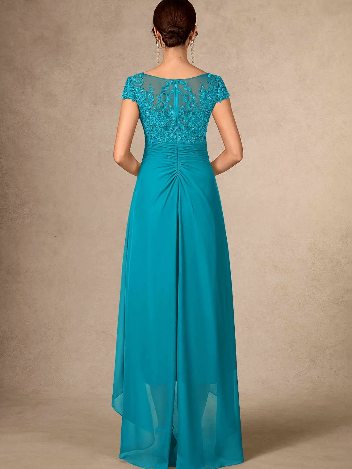 Back view of teal ruched V-neck chiffon mother-of-the-bride dress with floral sequin bodice