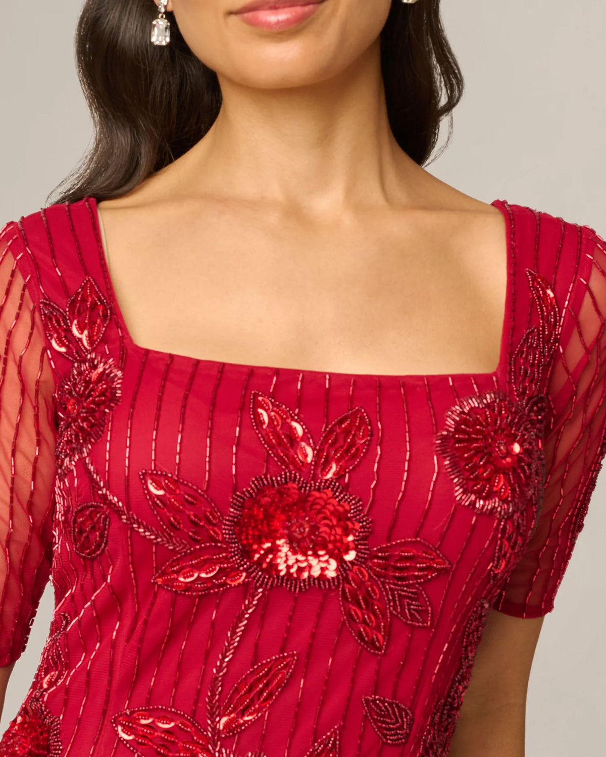 Cranberry red square-neck maxi dress with floral sequin appliques on sheer sleeves