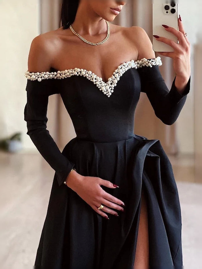 Black off-shoulder satin bodice with pearl-like beaded trim, long sleeves, A-line skirt with slit