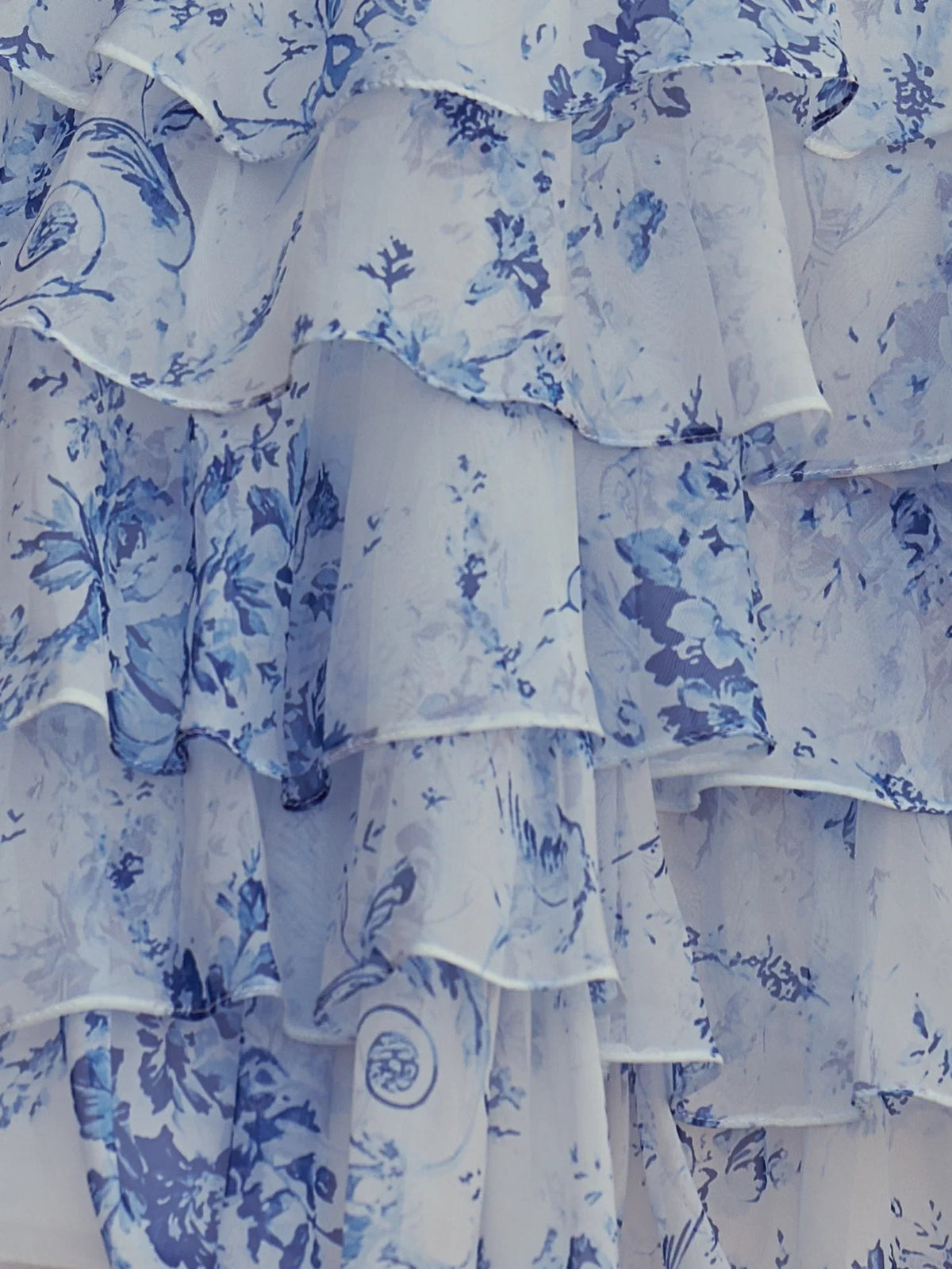 Close-up of blue floral tiered ruffle skirt layers