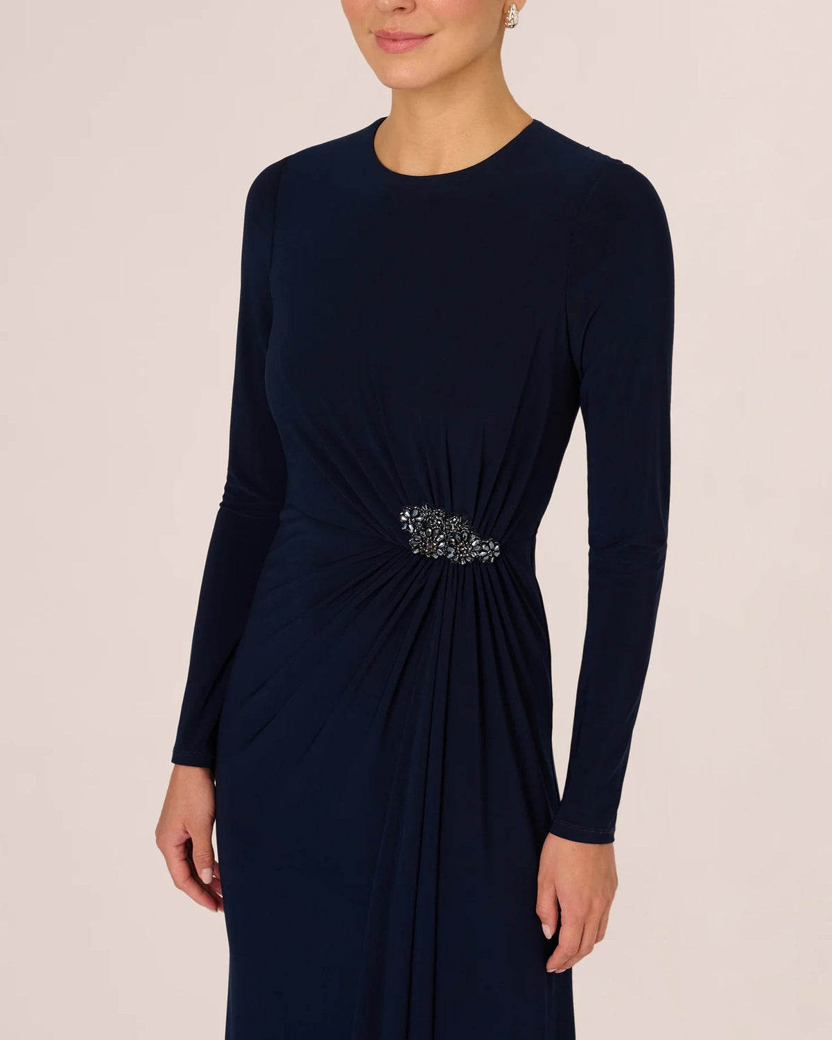 Midnight blue long-sleeve maxi dress with draped waist and beaded floral accent