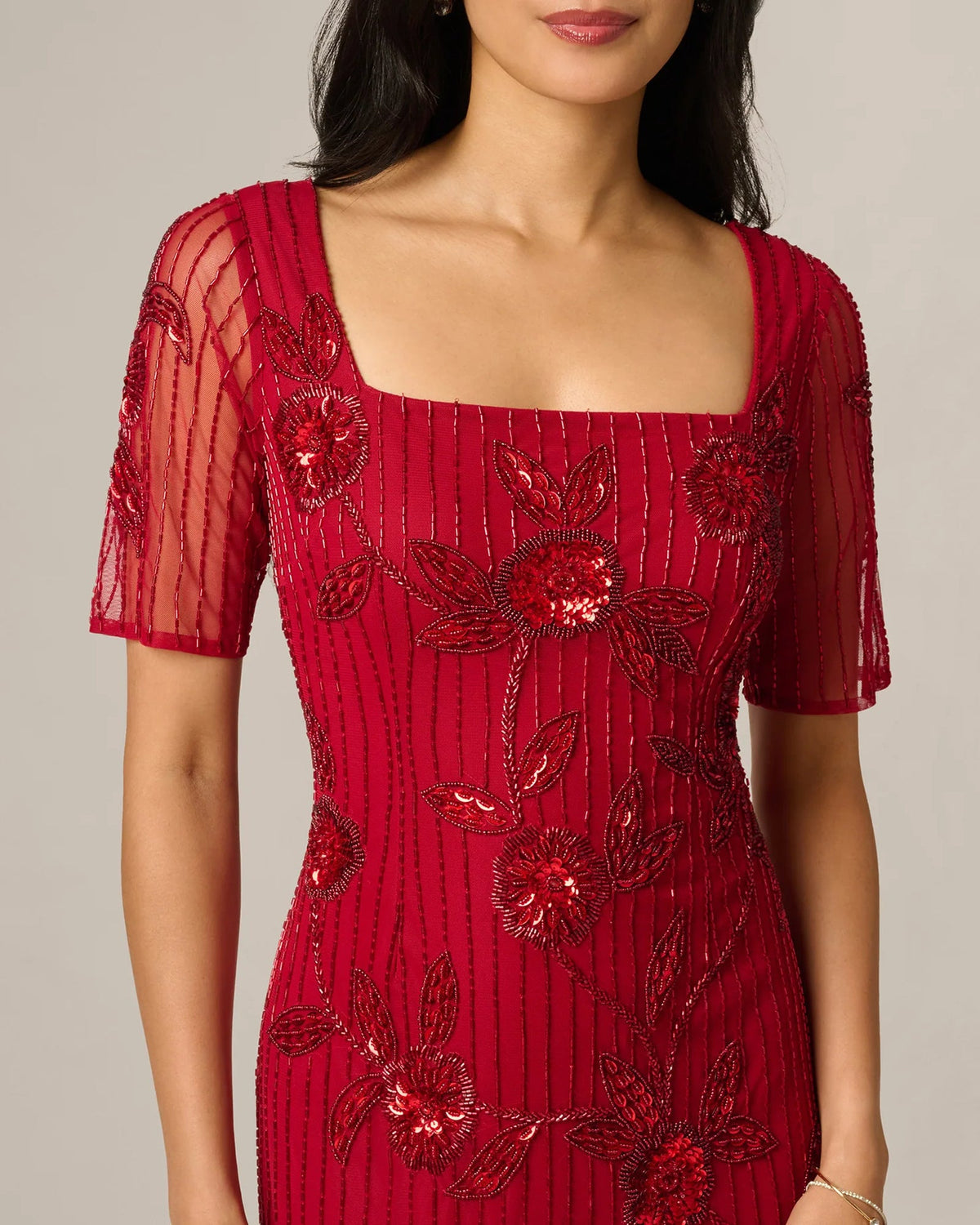 Cranberry beaded floral bodice with square neckline and short sleeves