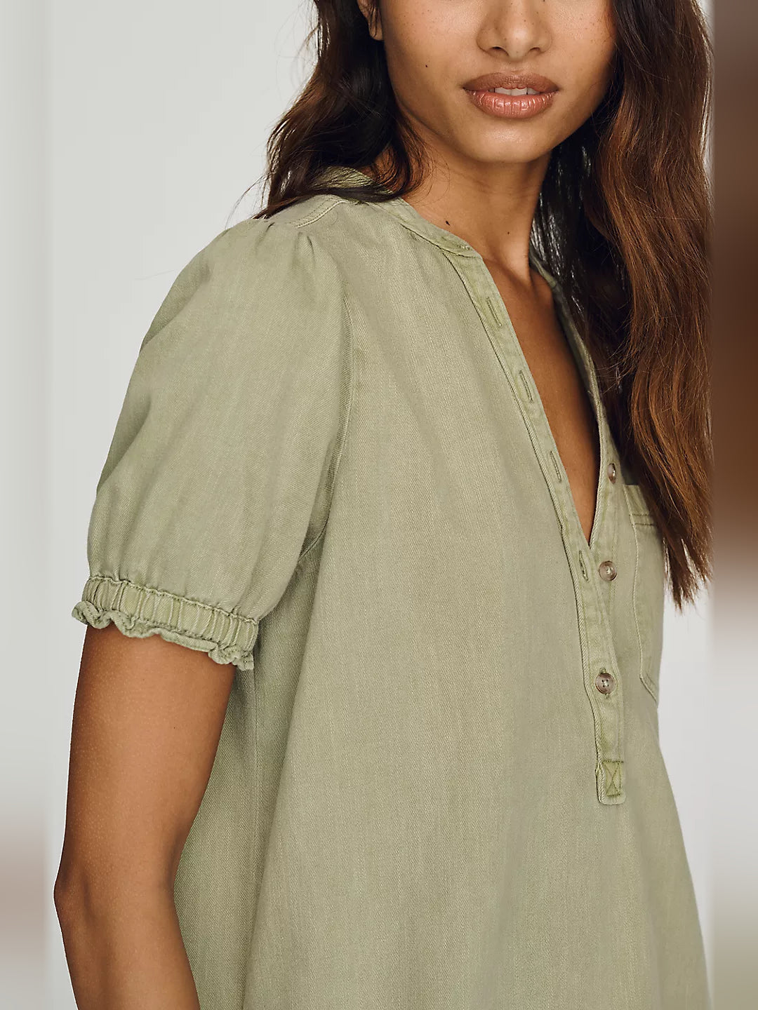 Sage puff sleeve mini dress detail with embroidered button placket