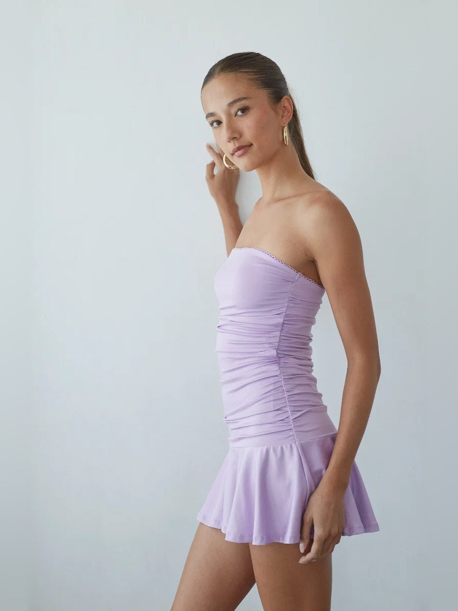 Lavender strapless mini dress with ruched detailing and flared tiered skirt