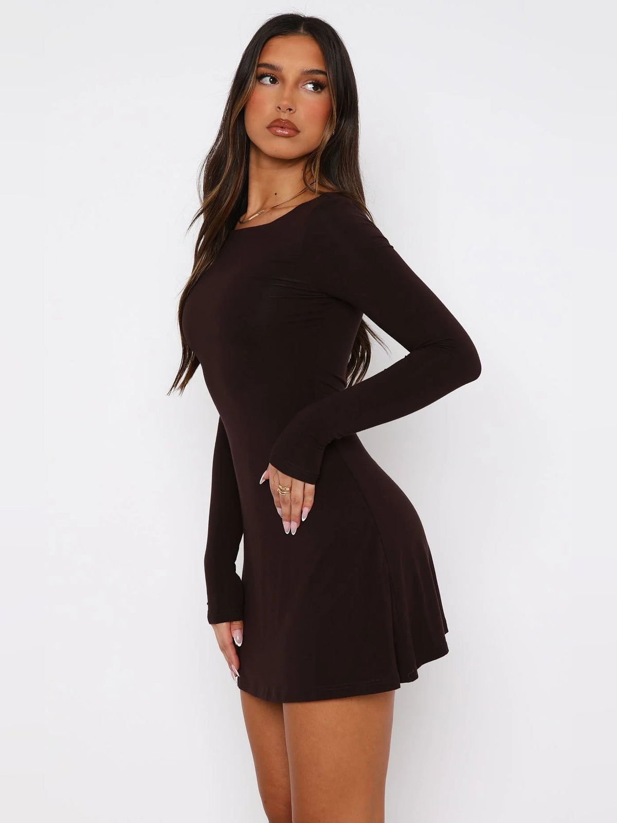 Chocolate long-sleeve mini dress in a fitted style, round neckline, flared skirt