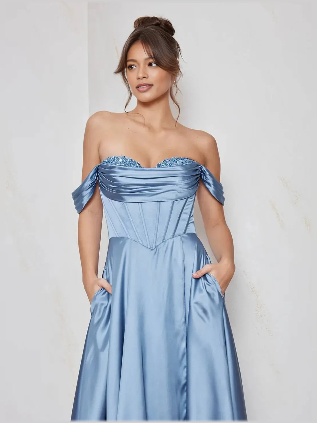 Steel blue off-shoulder corset dress with beaded neckline and draped satin bodice