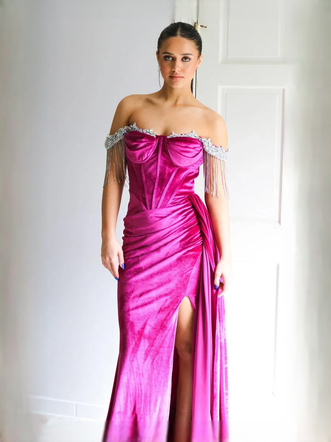 Magenta velvet sweetheart prom dress with ruched bodice and front slit