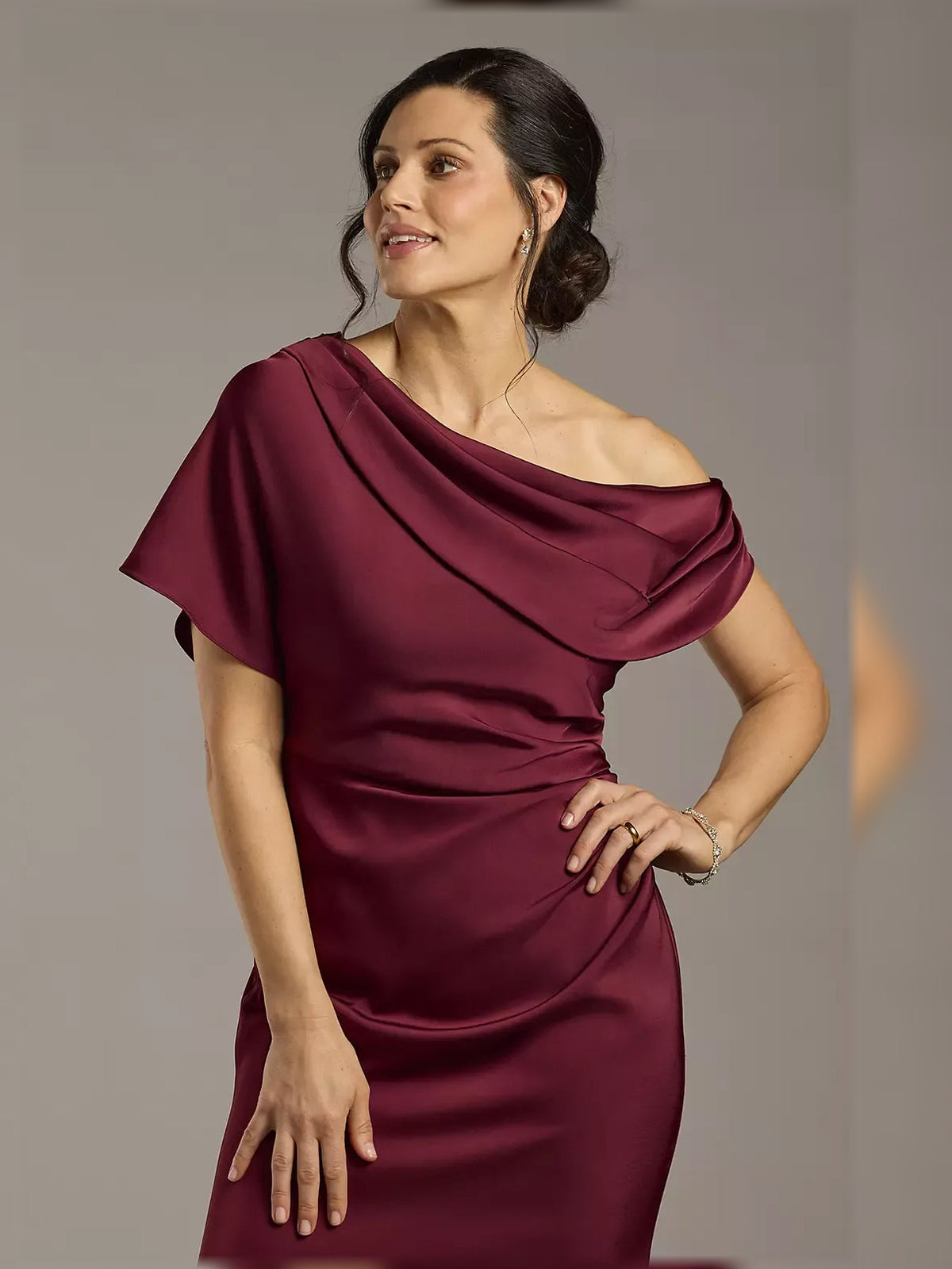 Burgundy one-shoulder satin sheath dress with draped ruffle shoulder detail