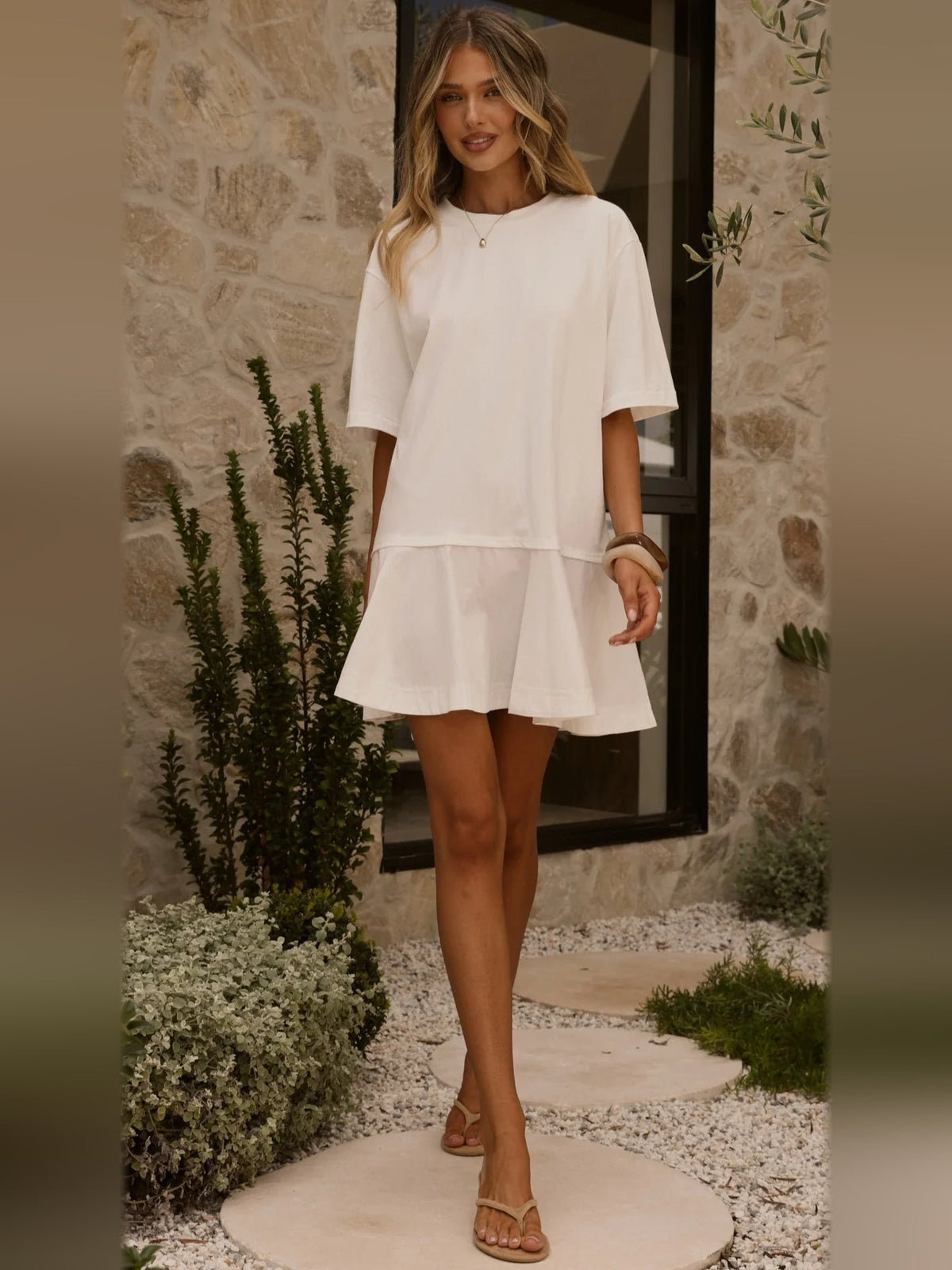 Off-white tiered mini dress with short sleeves and relaxed silhouette