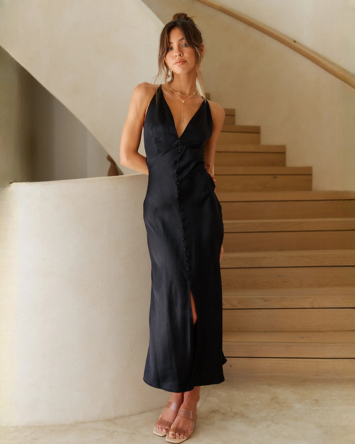 Black sleeveless satin A-line maxi dress with V-neck, ruched front, side slit