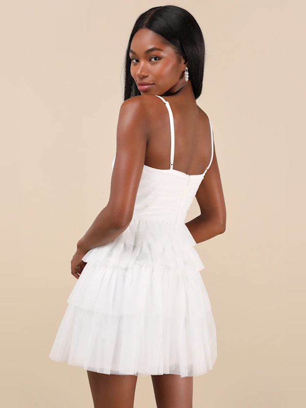 White tiered tulle mini dress with open-back straps and V-neck front