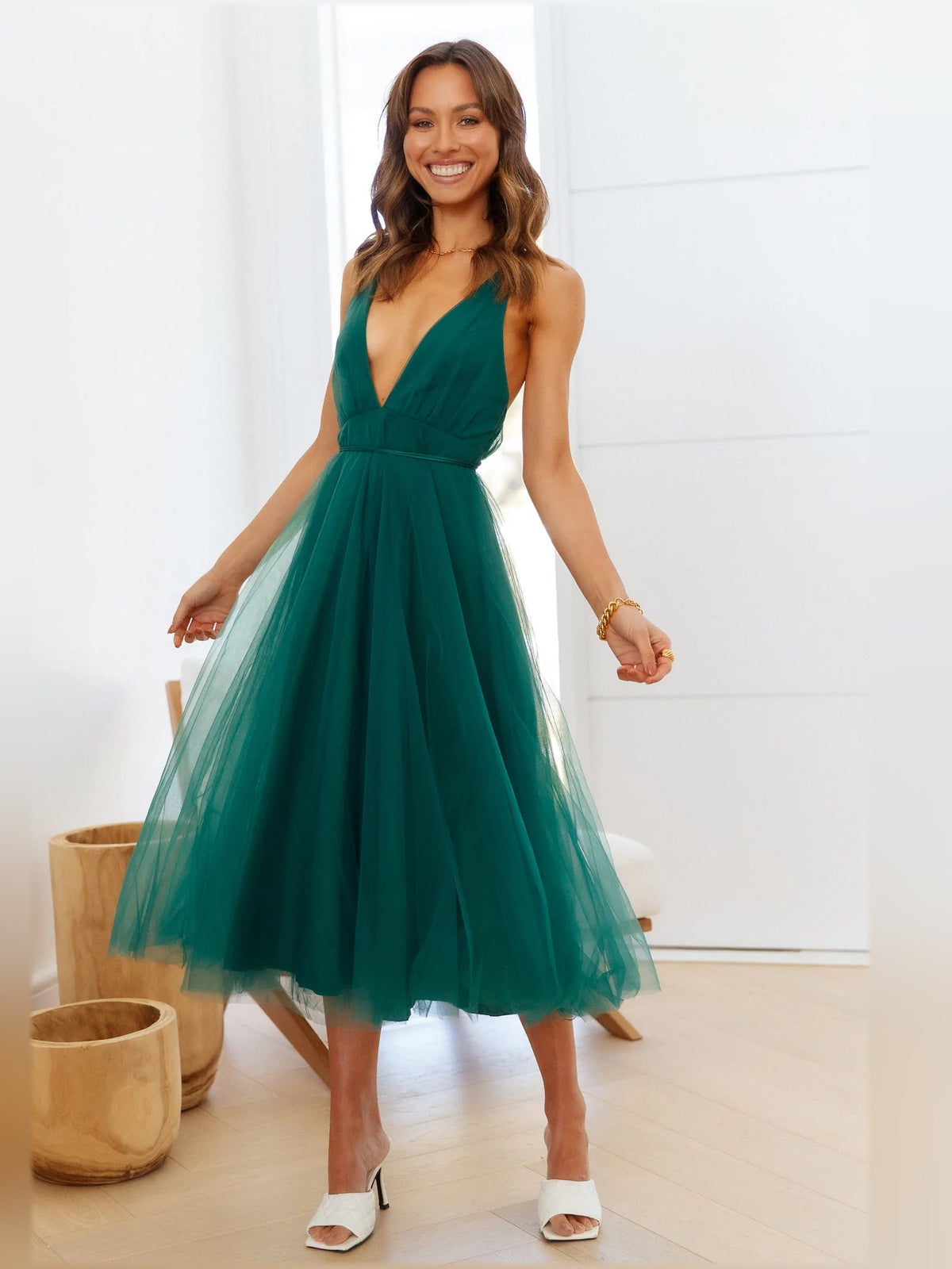 Forest green halter midi dress with fitted waist and airy tulle midi skirt