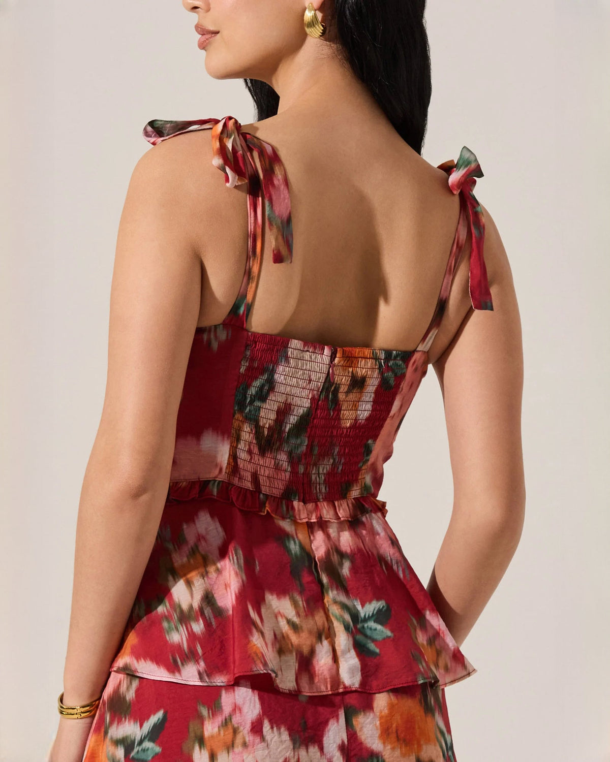 Red floral tiered maxi dress with open back and bow tie shoulder straps