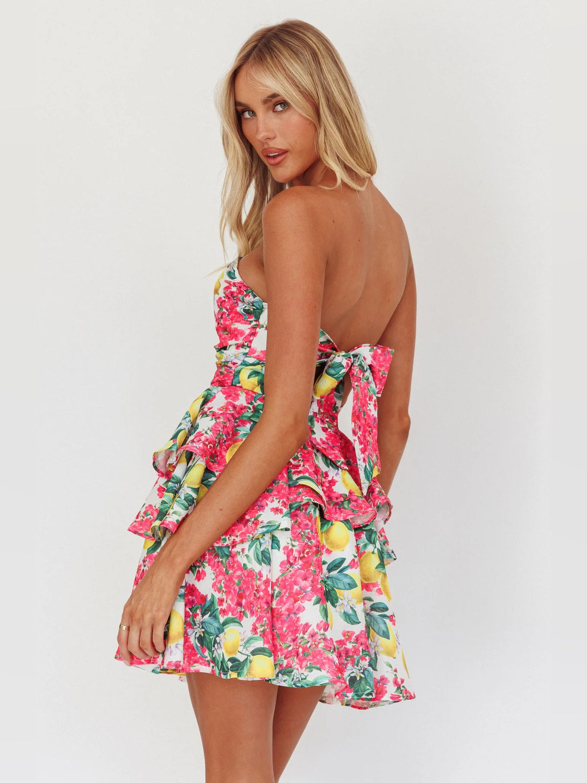 Layered mini dress in pink lemon floral print with backless strapless tiered skirt