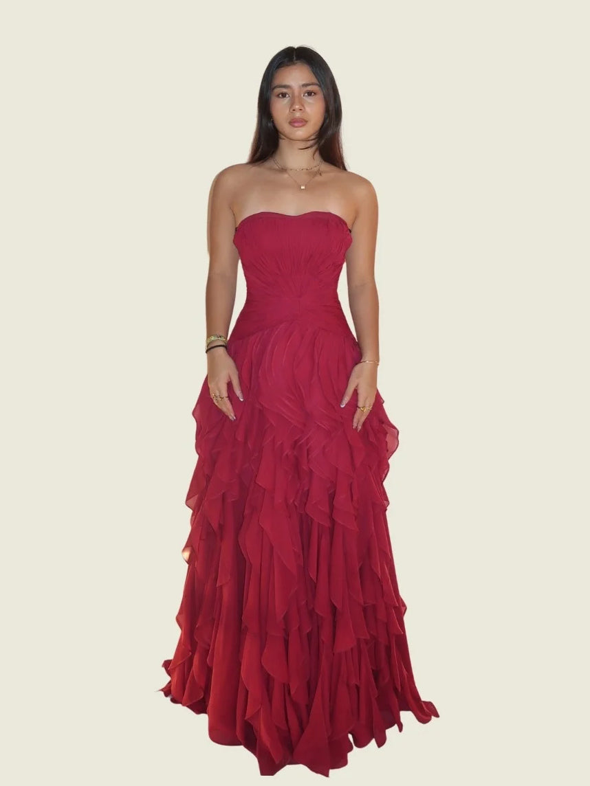 Red strapless sweetheart ball gown featuring ruched bodice and cascading layered ruffle skirt