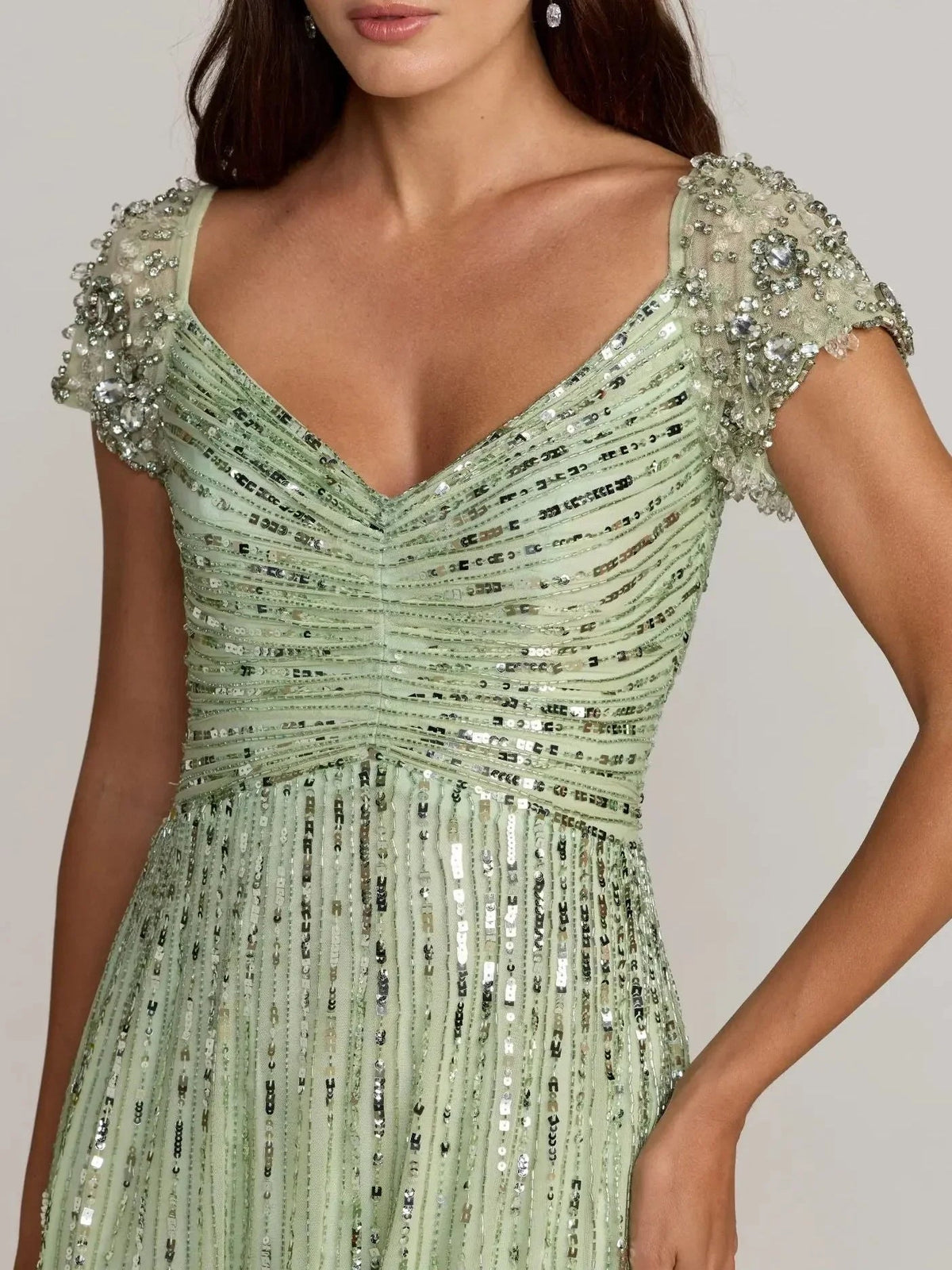 Mint green sweetheart formal dress with cap sleeves and all-over bead embellishment