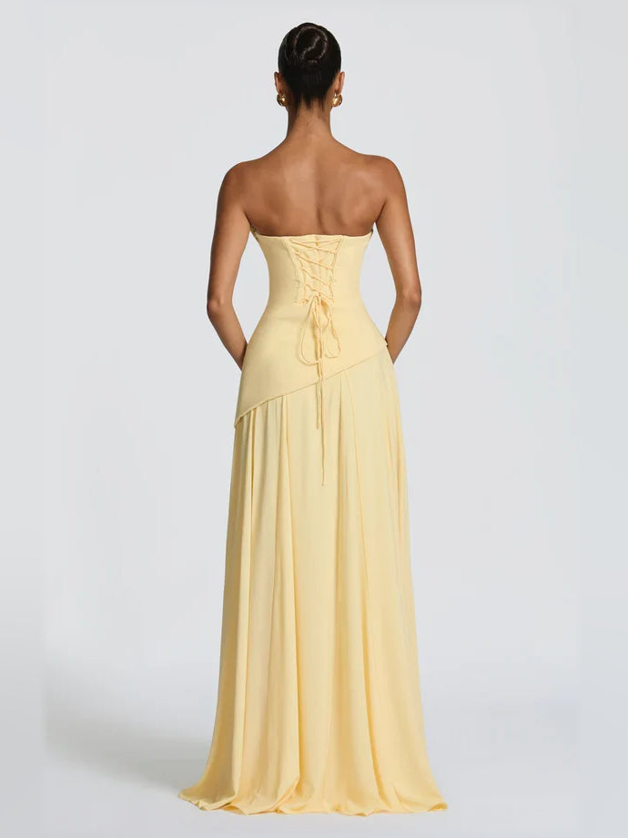 Back view of strapless yellow corset A-line formal dress with lace-up waist