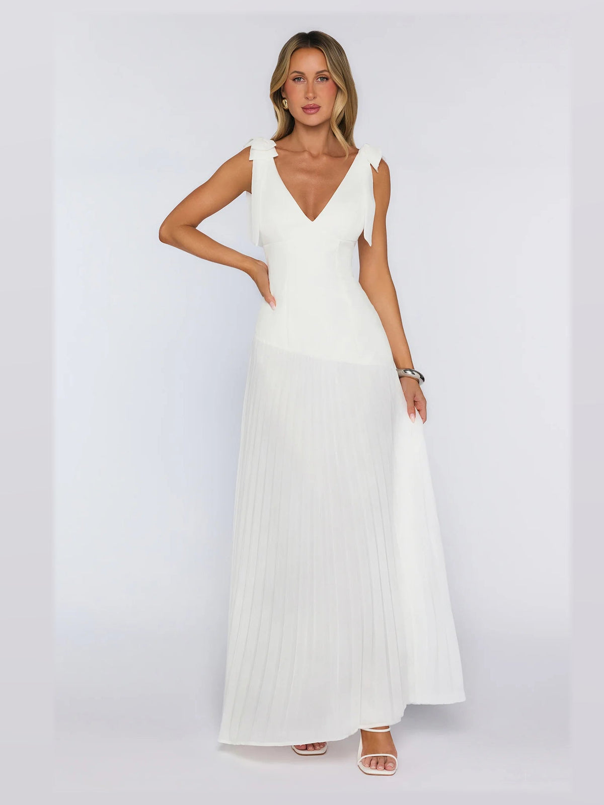 White formal dress with structured woven fabric construction and maxi hem