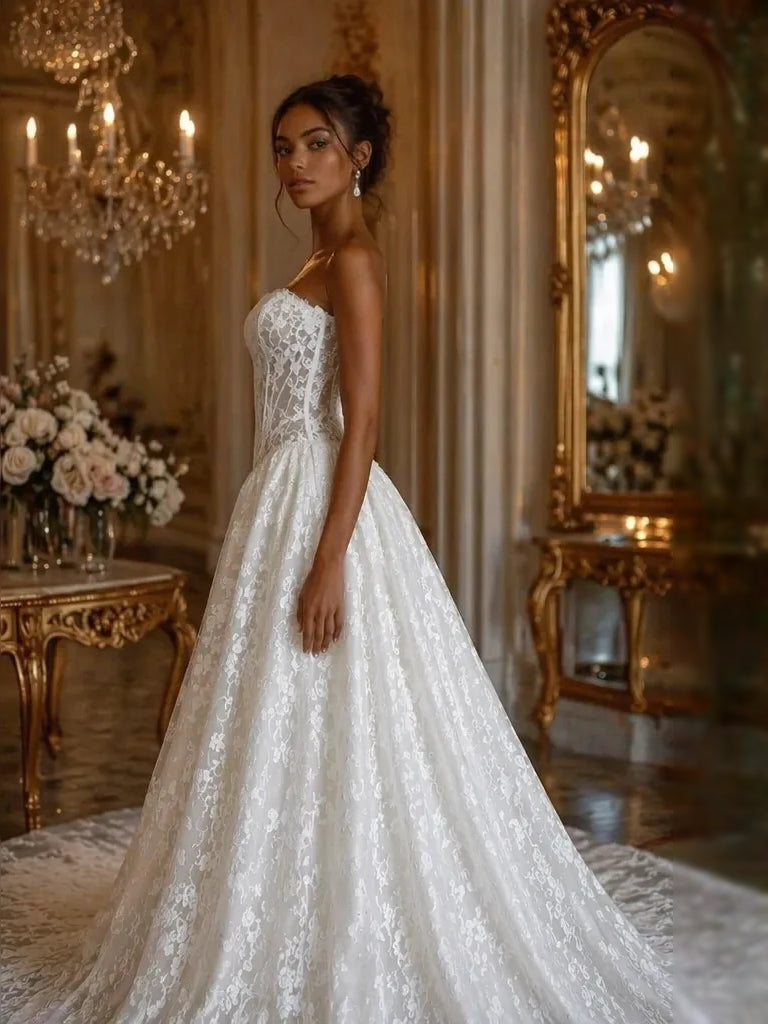 Ivory strapless corset wedding dress with floral lace detail and flowing A-line skirt