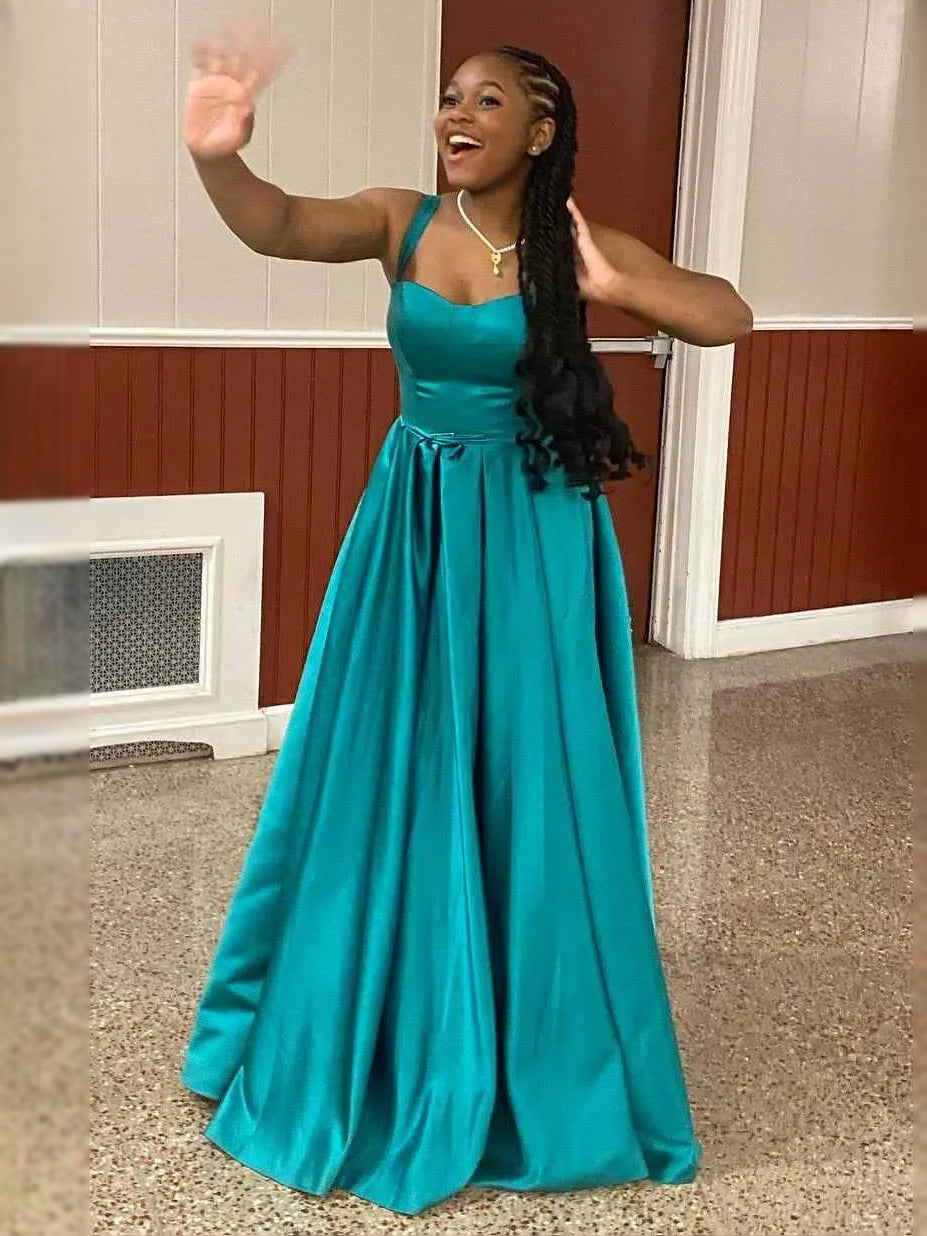 Teal satin sleeveless sweetheart ball gown with pleated full skirt and waist bow